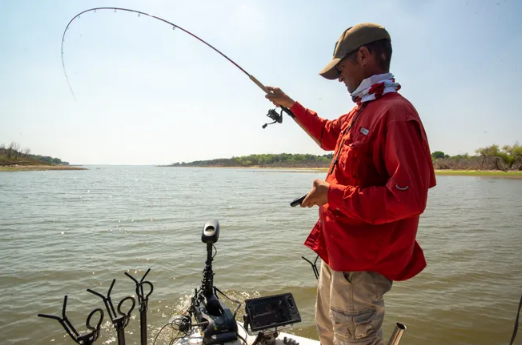 This photo take in 2022 shows fishing guide Joe Bragg casting in one of the shallower areas at Milford Lake, which has more surface area than any other lake in Kansas and is tied with Wilson Lake for being the second deepest.