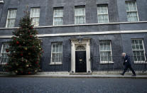 Britain's Prime Minister Boris Johnson returns to 10 Downing Street after meeting with Queen Elizabeth II at Buckingham Palace, London, on Friday, Dec. 13, 2019. Prime Minister Boris Johnson's Conservative Party has won a solid majority of seats in Britain's Parliament — a decisive outcome to a Brexit-dominated election that should allow Johnson to fulfil his plan to take the U.K. out of the European Union next month. (AP Photo/Matt Dunham)