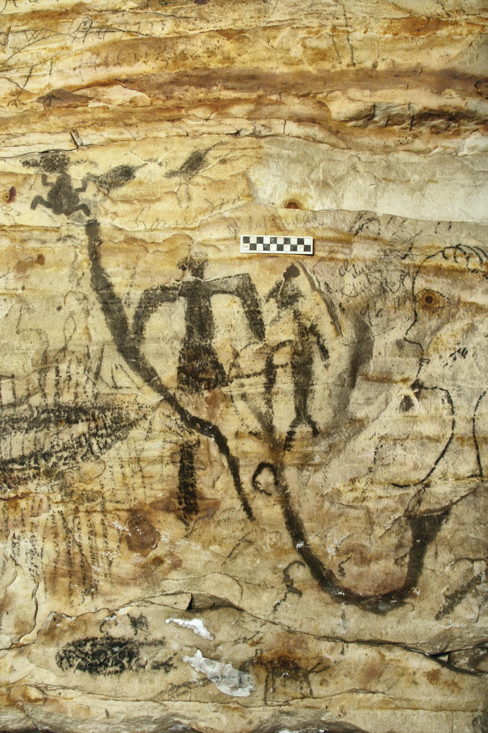 This undated photo provided by Alan Cressler shows a Missouri cave featuring artwork from the Osage Nation dating more than 1,000 years was sold at auction on Tuesday, Sept. 14, 2021. The art inside "Picture Cave" shows humans, animals and mythical creatures. Experts who have studied the cave were concerned about the auction, but the director of the auction company said protections are in place to prohibit the new buyer from exploiting the cave, including a Missouri law that makes doing so a crime. (Alan Cressler via AP)