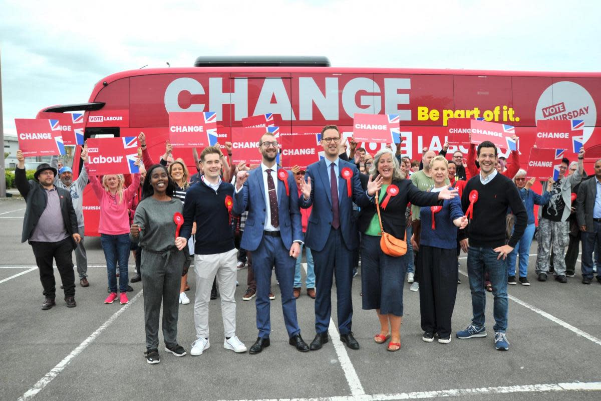 A crowd of Labour Party supporters greet Shadow Chief Secretary to the Treasury Darren Jones as the battle bus arrives in Greenbridge, with North and South Swindon candidates Will Stone and Heidi Alexander <i>(Image: Dave Cox)</i>