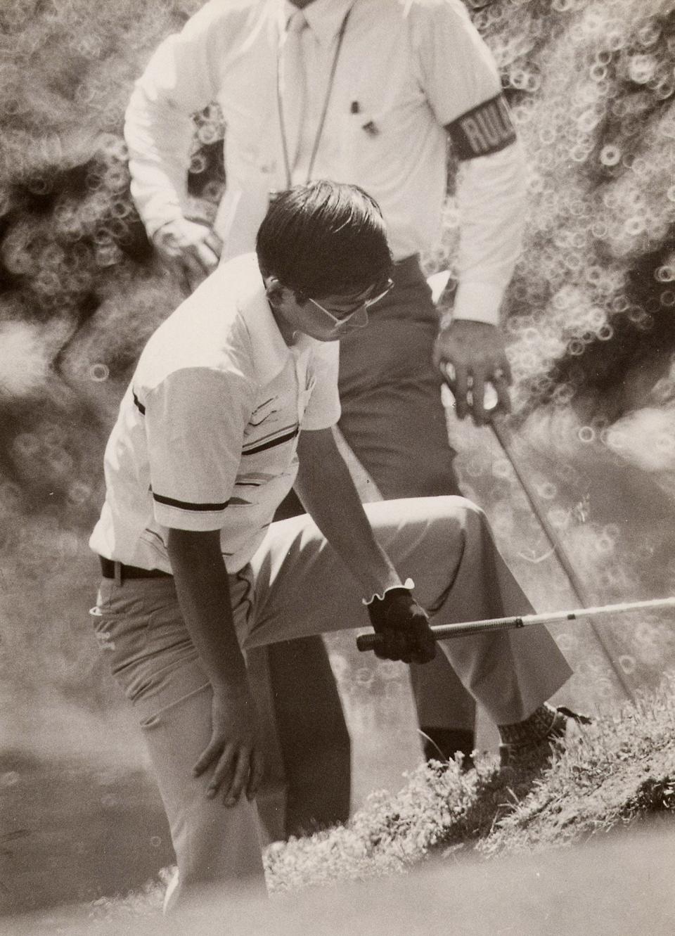 Tommy Nakajima tries to play out of the Rae's Creek tributary on No. 13 at the 1978 Masters
Lee Downing Staff Photo 4/7/78 SPORTS