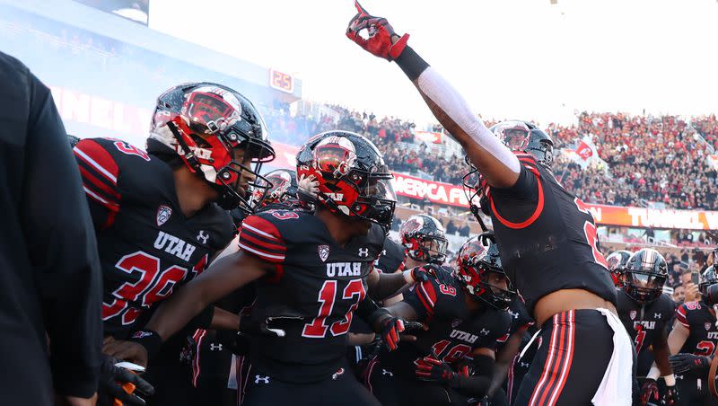 Utah players run onto the field ahead of a game against USC at Rice-Eccles Stadium in Salt Lake City on Saturday, Oct. 15, 2022. 