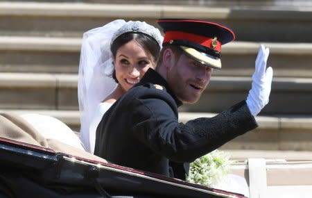 Britain's Prince Harry, Duke of Sussex and Meghan, Duchess of Sussex depart the St George's Chapel in Windsor Castle after their royal wedding ceremony, in Windsor, Britain, May 19, 2018. NEIL HALL/Pool via REUTERS