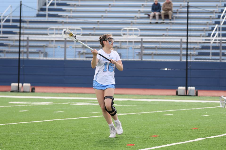 West Morris senior Kaitlyn Cronin looks for a pass during a NJGILL Freedom North girls lacrosse game against Roxbury on April 5.