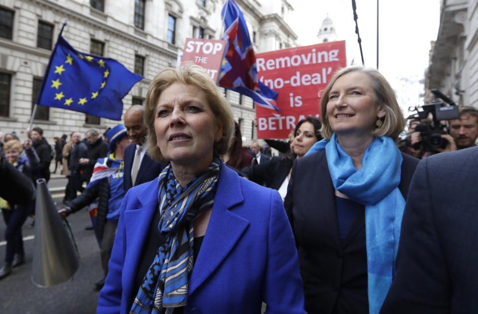 CAPTION CORRECTS NAME SPELLING - British politicians Anna Soubry, left, and Sarah Wollaston arrive for a press conference in Westminster in London, Wednesday, Feb. 20, 2019. Cracks in Britain's political party system yawned wider Wednesday, as three pro-European lawmakers - Soubry, Allen and Wollaston - quit the governing Conservatives to join a newly formed centrist group of independents who are opposed to the government's plan for Britain's departure from the European Union.(AP Photo/Kirsty Wigglesworth)