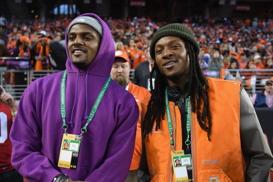 Deshaun Watson and DeAndre Hopkins of the Houston Texans look on prior to the CFP National Championship between the Alabama Crimson Tide and the Clemson Tigers. (Getty Images)