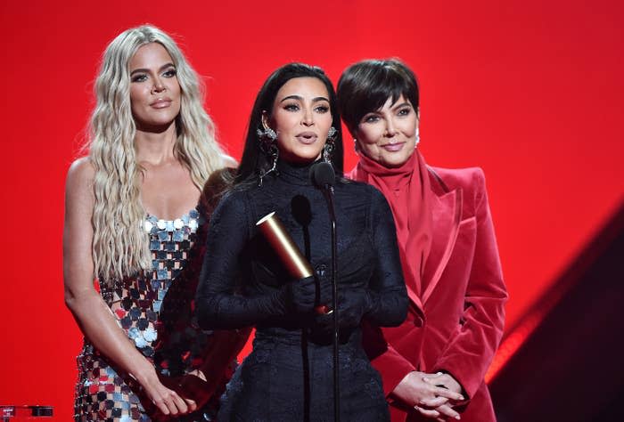 Khloé Kardashian, Kim Kardashian, and Kris Jenner onstage