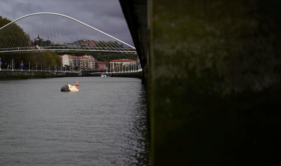 A fibreglass sculpture entitled 'Bihar' (Tomorrow in Basque), by Mexican hyperrealist artist Ruben Orozco, is submerged in the Nervion river in Bilbao, Spain, September 27, 2021. REUTERS/Vincent West