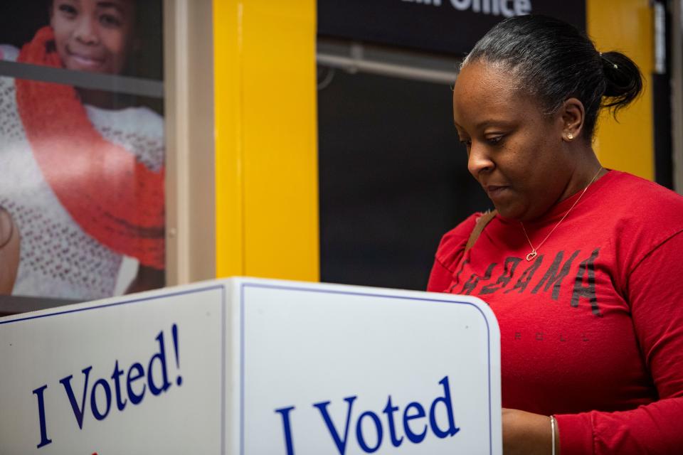 Rosetta Garrett casts her vote at the Whitehall Elementary School precinct during the Democratic primary election in Anderson, S.C., on Saturday, Feb. 3, 2024.