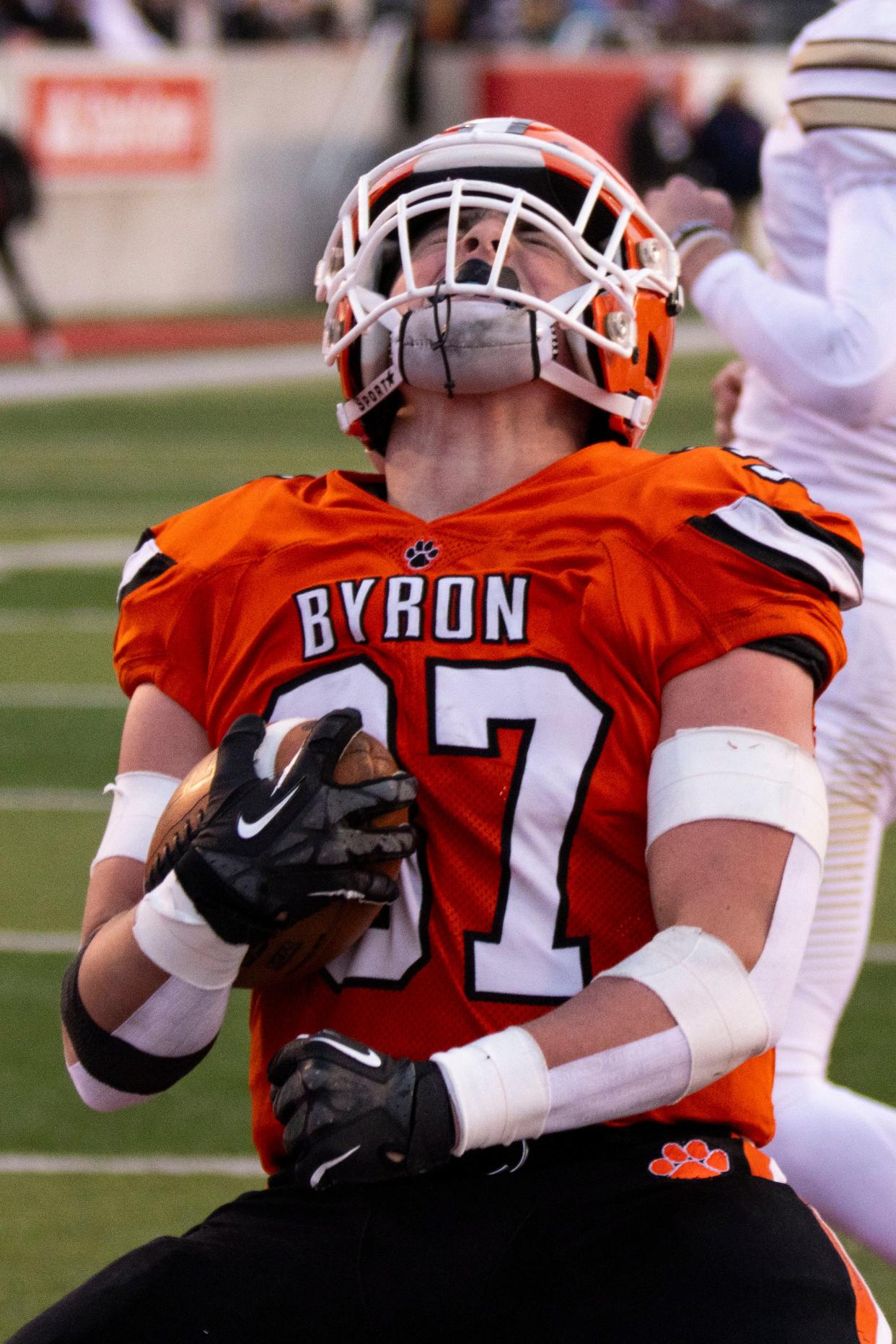 Byron running back Caden Considine (37) yells to the sky after scoring a touchdown at the beginning of the IHSA Class 3A state championship game on Nov. 24, 2023 at Hancock Stadium.