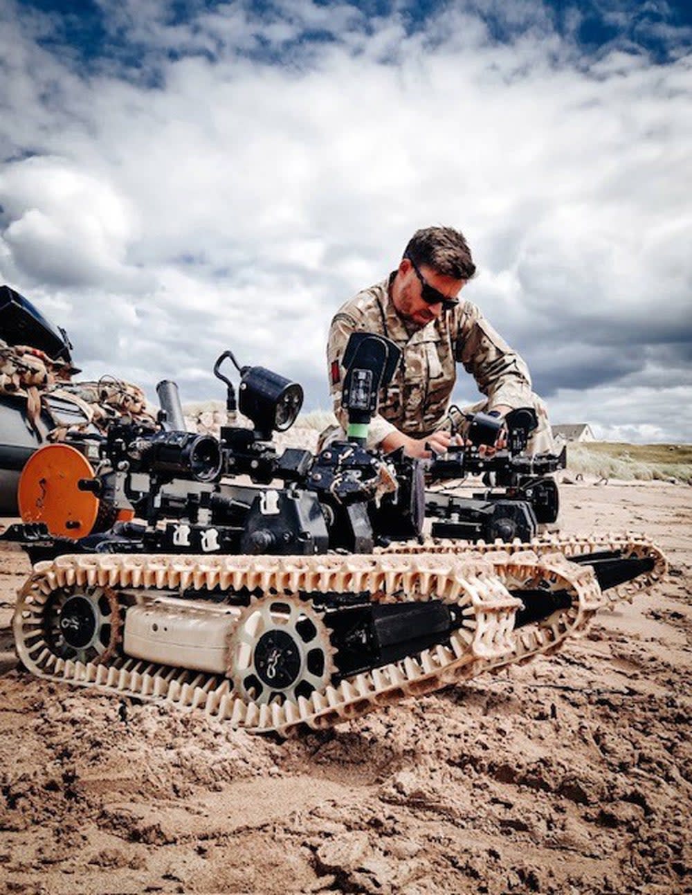 Handout photo issued by the Royal Navy of their divers, bomb disposal and mine warfare experts who have been training their Ukrainian counterparts on the waters of Loch Ewe (PA)