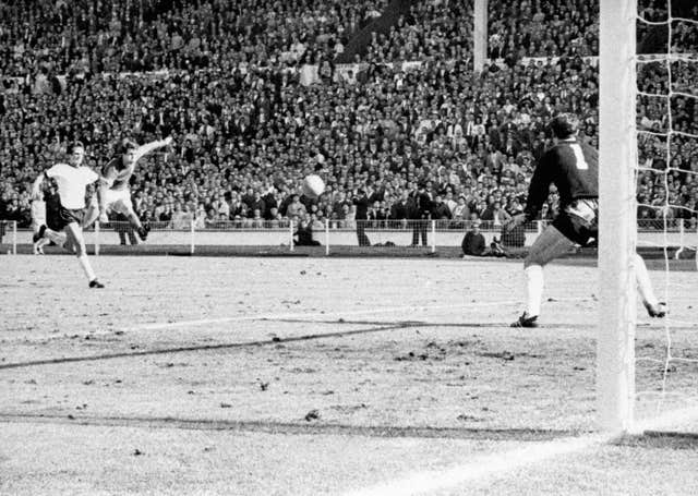 England’s Geoff Hurst shoots past shot German goalkeeper Hans Tilkowsk