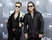 Brian Kelley (L) and Tyler Hubbard of the band Florida Georgia Line arrive at the 49th Annual Academy of Country Music Awards in Las Vegas, Nevada April 6, 2014. REUTERS/Steve Marcus (UNITED STATES - Tags: ENTERTAINMENT)(ACMAWARDS-ARRIVALS)