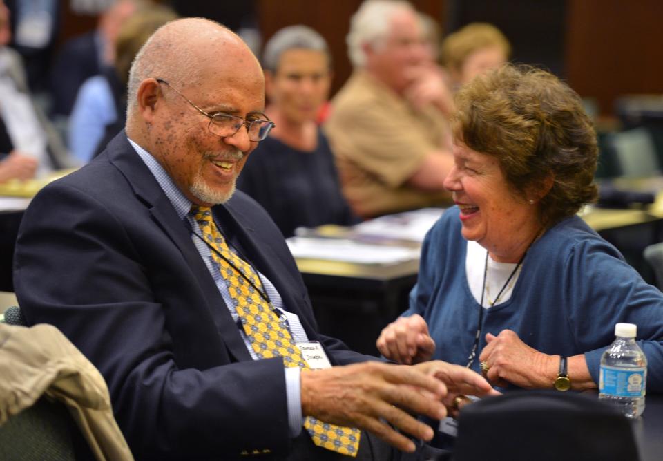 Former U.S. Ambassador to South Africa James A. Joseph, shares a laugh with Carol Fox, before speaking to  a session of the Lifelong Learning Academy on the topic of charitable giving on Feb. 9, 2015.