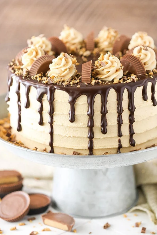 <p>Life Love and Sugar</p><p>Layers of moist chocolate cake, peanut butter frosting and chopped Reese’s peanut butter cups! It’s rich, delicious and so fun!</p><p><strong>Get the recipe: <a href="https://www.lifeloveandsugar.com/peanut-butter-chocolate-layer-cake/" rel="nofollow noopener" target="_blank" data-ylk="slk:Peanut Butter Chocolate Layer Cake;elm:context_link;itc:0;sec:content-canvas" class="link ">Peanut Butter Chocolate Layer Cake</a></strong></p>