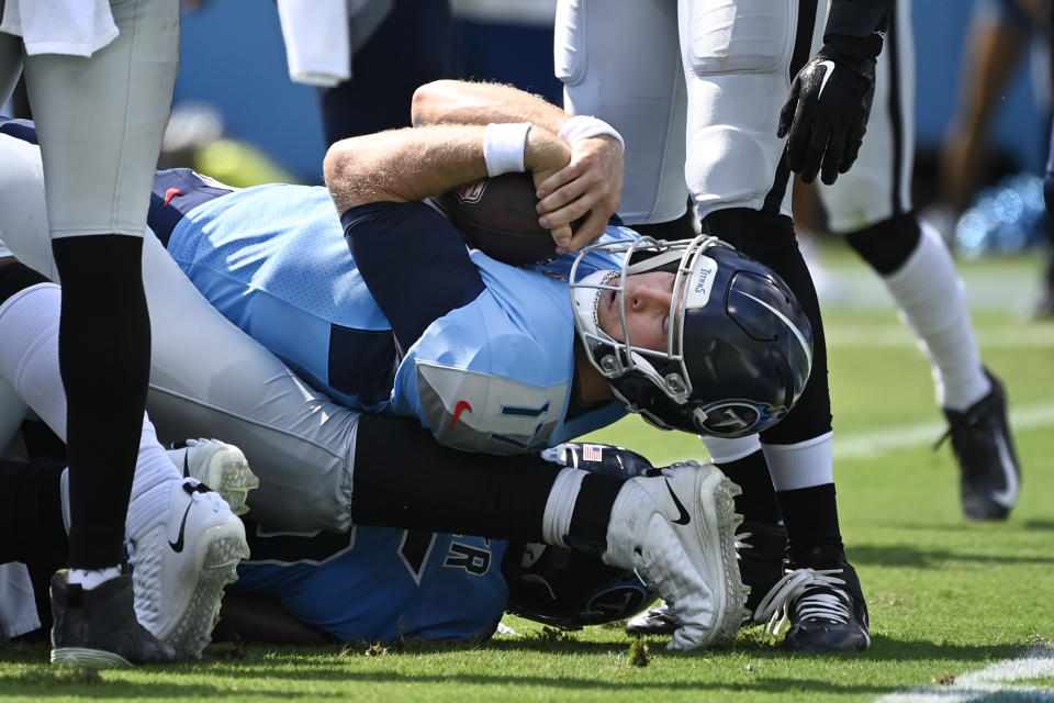 Tennessee Titans quarterback Ryan Tannehill (17) scores a touchdown on a 1-yard run against the Las Vegas Raiders in the first half of an NFL football game Sunday, Sept. 25, 2022, in Nashville, Tenn. (AP Photo/Mark Zaleski)