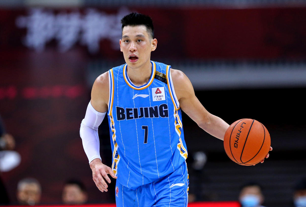 This photo taken on August 4, 2020 shows Beijing Ducks' Jeremy Lin driving the ball during the Chinese Basketball Association (CBA) match between Beijing Ducks and Guangdong Southern Tigers in Qingdao in China's eastern Shandong province. (Photo by STR / AFP) / China OUT (Photo by STR/AFP via Getty Images)