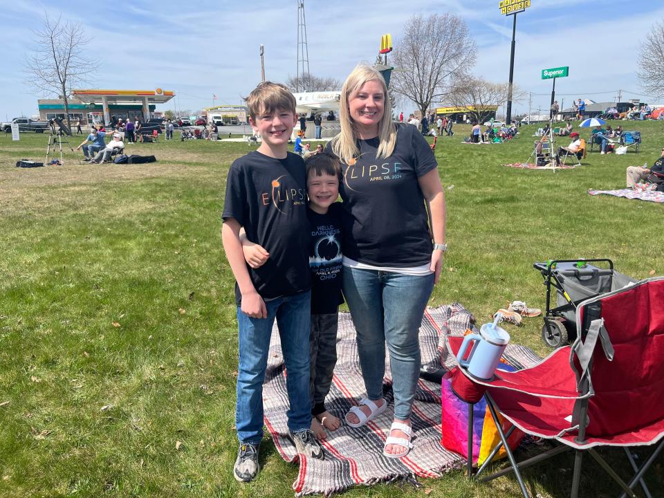 Camdyn Clark, 11; Owen Clark, 8; and their mom Jessica Clark, 41, at the Armstrong Air & Space Museum in Wapakoneta. The family, from Pataskala, drove up Sunday night to see the eclipse in totality and said it was "worth it."