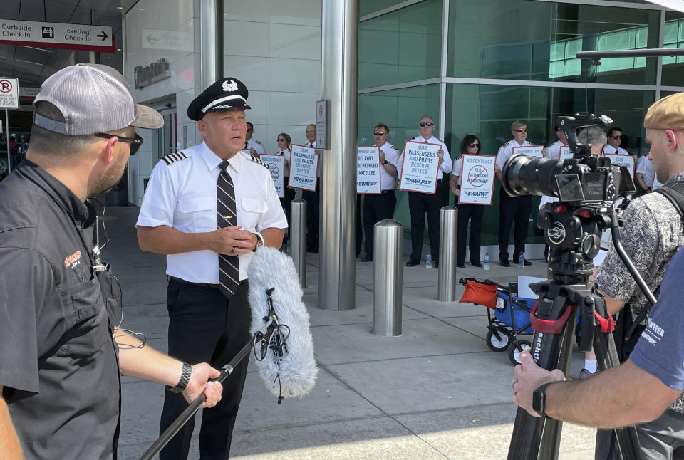 Casey Murray, president of the Southwest Airlines Pilots Association, talks about union picketing at Dallas Love Field on Tuesday, June 21, 2022, in Dallas. (AP Photo/David Koenig)