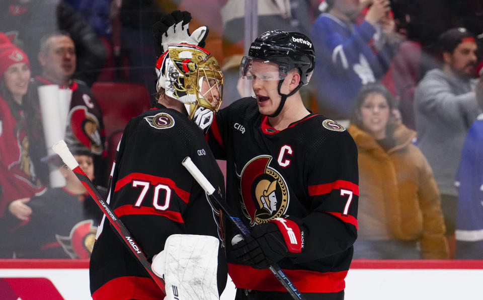 Ottawa Senators captain Brady Tkachuk (7) congratulates Ottawa goaltender Joonas Korpisalo (70) after an NHL hockey game against the Toronto Maple Leafs in Ottawa, Ontario, Saturday, Feb. 10, 2024. (Sean Kilpatrick/The Canadian Press via AP)