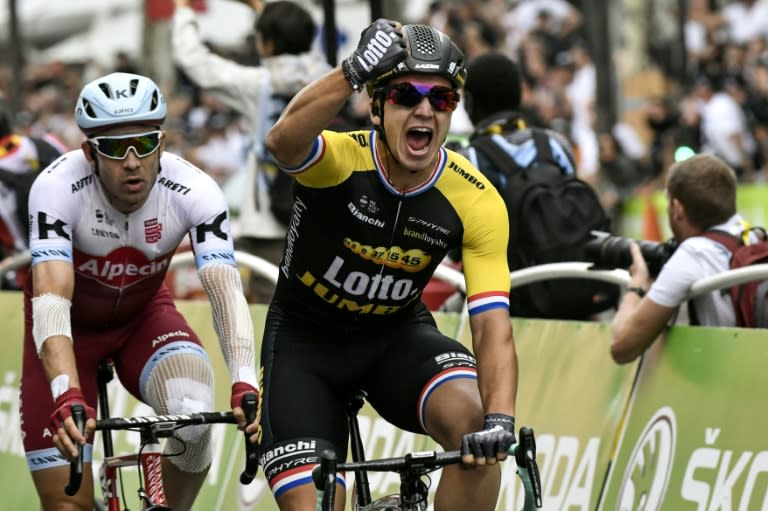 Netherlands' Dylan Groenewegen (R) celebrates as he crosses the finish line to win the 21st and final stage of the Tour de France