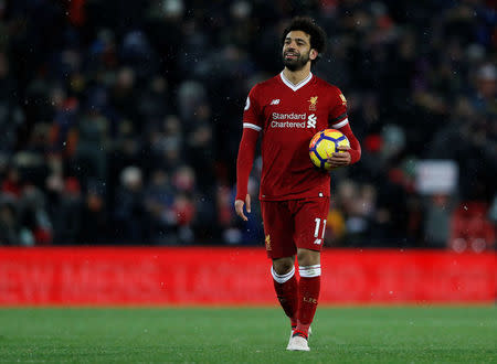 Soccer Football - Premier League - Liverpool vs Watford - Anfield, Liverpool, Britain - March 17, 2018 Liverpool's Mohamed Salah celebrates with the match ball after the match Action Images via Reuters/Lee Smith