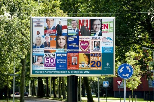 Election posters are displayed on a billboard in the Hague. The Netherlands began voting in crunch polls Wednesday seen as a barometer of anti-European sentiment after a riveting campaign that has shaped into a tight race between two pro-Europe parties