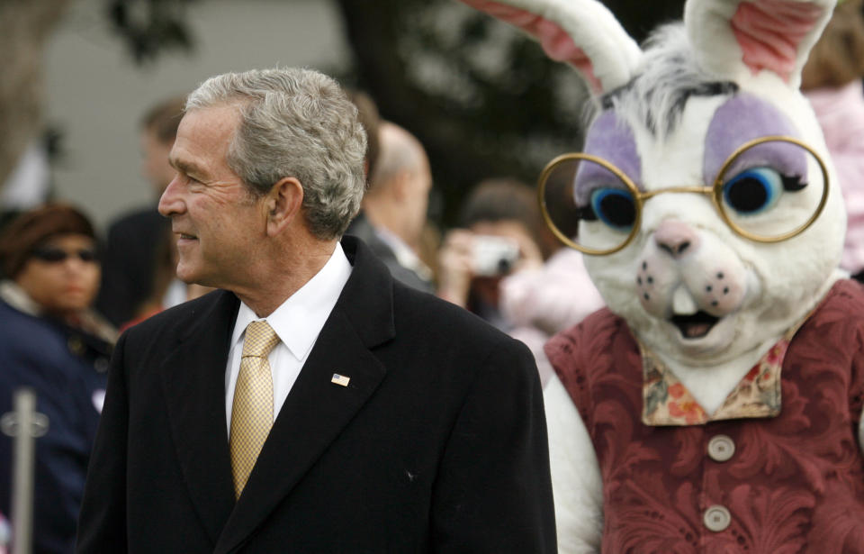 Another Easter Bunny stands behind President Bush during the Easter Egg Roll in 2006.