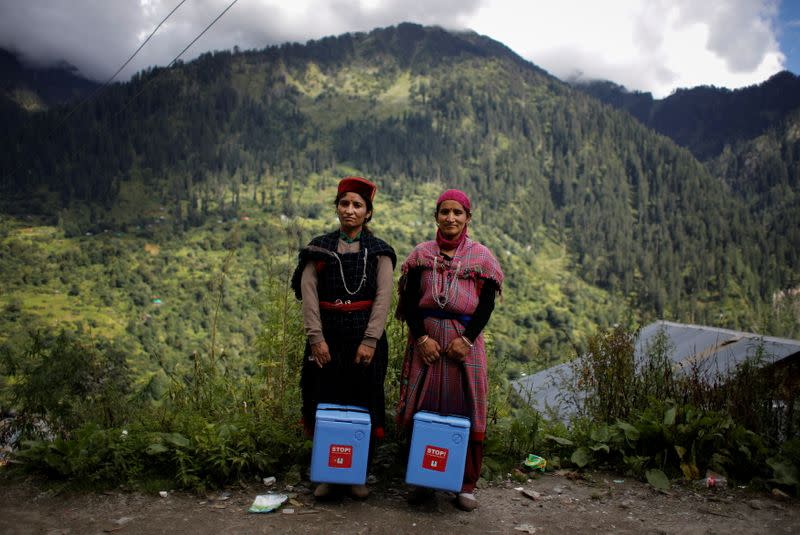 The Wider Image: Doctors scale rockslides, invoke gods to vaccinate Himalayan villages