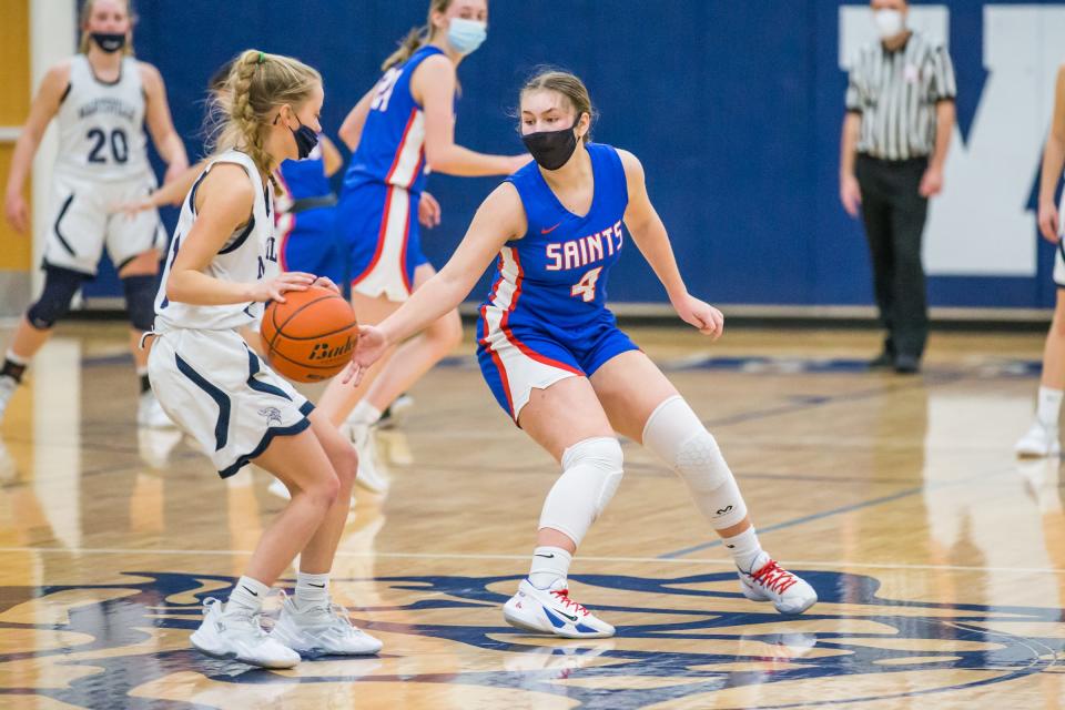 St. Clair's Erin Seros defends during a game last season. The junior scored a team-high 13 points in the Saints' 48-22 win over Warren Fitzgerald at home on Friday.