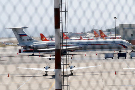 An airplane with the Russian flag is seen at Simon Bolivar International Airport in Caracas, Venezuela March 24, 2019. REUTERS/Carlos Jasso