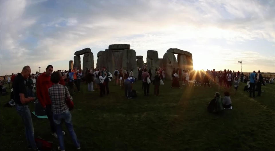 The sun sets at Stonehenge as a crowd gathers to celebrate the summer solstice in the British county of Wiltshire on Thursday, June 20, 2024. / Credit: English Heritage via Reuters