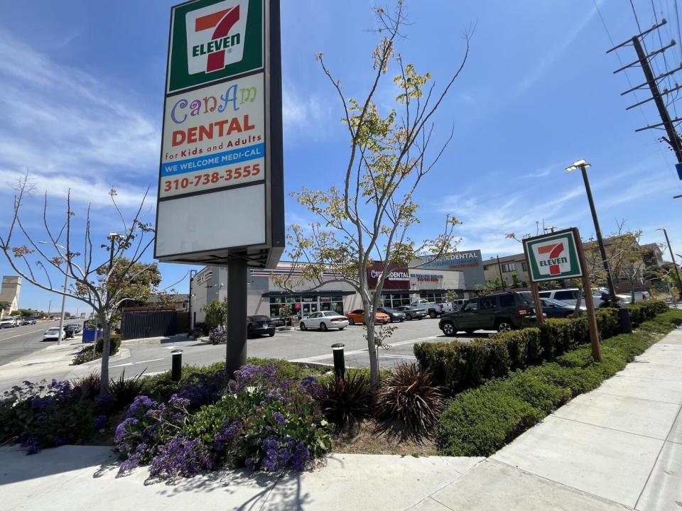 A street corner with a convenience store.