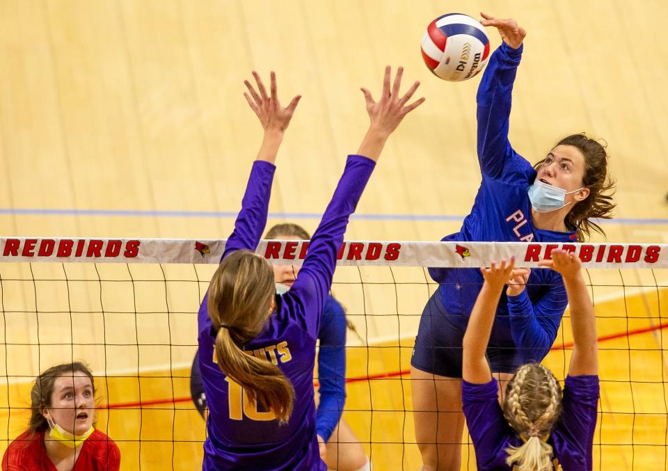 Pleasant Plains' Sydney McAfee (12) fires a spike against Palos Heights Chicago Christian during the semifinals of the IHSA Class 2A State Final Tournament at Redbird Arena in Normal, Ill., Friday, November 12, 2021. [Justin L. Fowler/The State Journal-Register] 