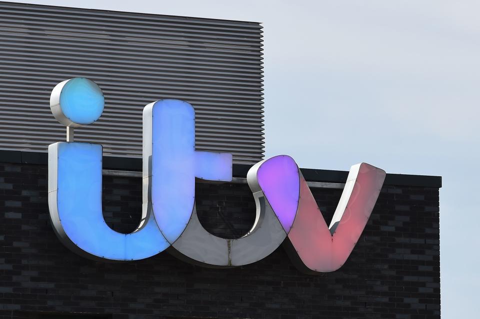 A picture shows the logo of broadcaster ITV at their MediaCityUK studios in Salford, Greater Manchester, northwest England, on May 14, 2019. - All episodes of a popular British talk show have been pulled from the internet and filming has been suspended after the reported suicide of a former guest Tuesday. Broadcaster ITV pulled its most popular daytime show "The Jeremy Kyle Show" off air indefinitely following the death of 63-year-old Steve Dymond, a week after he appeared on an episode. (Photo by Paul ELLIS / AFP)        (Photo credit should read PAUL ELLIS/AFP/Getty Images)