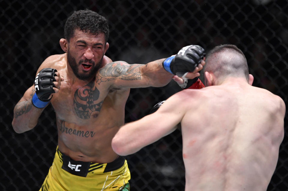 LAS VEGAS, NEVADA – JANUARY 15: (L-R) Joanderson Brito of Brazil punches Bill Algeo in their featherweight fight during the UFC Fight Night event at UFC APEX on January 15, 2022 in Las Vegas, Nevada. (Photo by Jeff Bottari/Zuffa LLC via Getty Images)