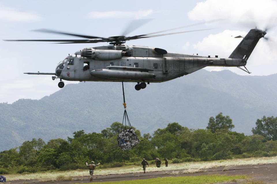 <p> FILE - In this Saturday Oct. 10, 2009, file photo, a U.S. military helicopter, the CH-53E Super Stallion, airlifts humanitarian aid to be dropped in affected regions around Pariaman, north of Padang, Indonesia. On Tuesday, April 3, 2018, a CH-53E Super Stallion similar to the one shown went down shortly after 2:30 p.m., during a training mission near El Centro, Calif., a few miles from the U.S.-Mexico border. (AP Photo/Wong Maye-E, File) </p>