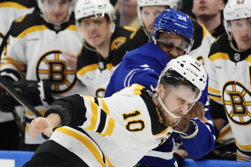 Toronto Maple Leafs' Wayne Simmonds (24) and Boston Bruins' A.J. Greer (10) fight during the third period of an NHL hockey game, Wednesday, Feb.1, 2023 in Toronto. (Frank Gunn/The Canadian Press via AP)
