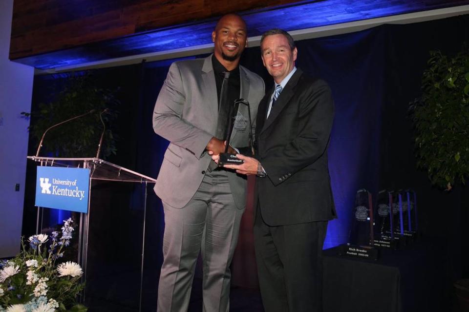 Chuck Hayes, left, was congratulated by Kentucky athletics director Mitch Barnhart upon his induction into the UK Athletics Hall of Fame in 2016.