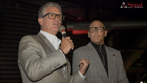 Mark W. Davis and Frank Torre, co-CEOs of Signal Restoration Services, make remarks at 50th Anniversary Event