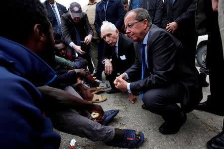 FILE PHOTO: U.N. Special Representative and Head of the United Nations Support Mission in Libya Martin Kobler and International Organization for Migration Director General William Lacy Swing visit illegal African migrants at a detention camp in Tripoli, Libya, March 22, 2017. REUTERS/Ismail Zitouny/File Photo