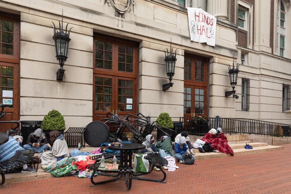 Pro-Palestinian student protestors and activists sit outside of Hamilton Hall at Columbia University in New York City on April 30, 2024. Demonstrators at Columbia University barricaded themselves inside a campus building early Tuesday, escalating a standoff with school officials as pro-Palestinian protests upend campuses across the United States.