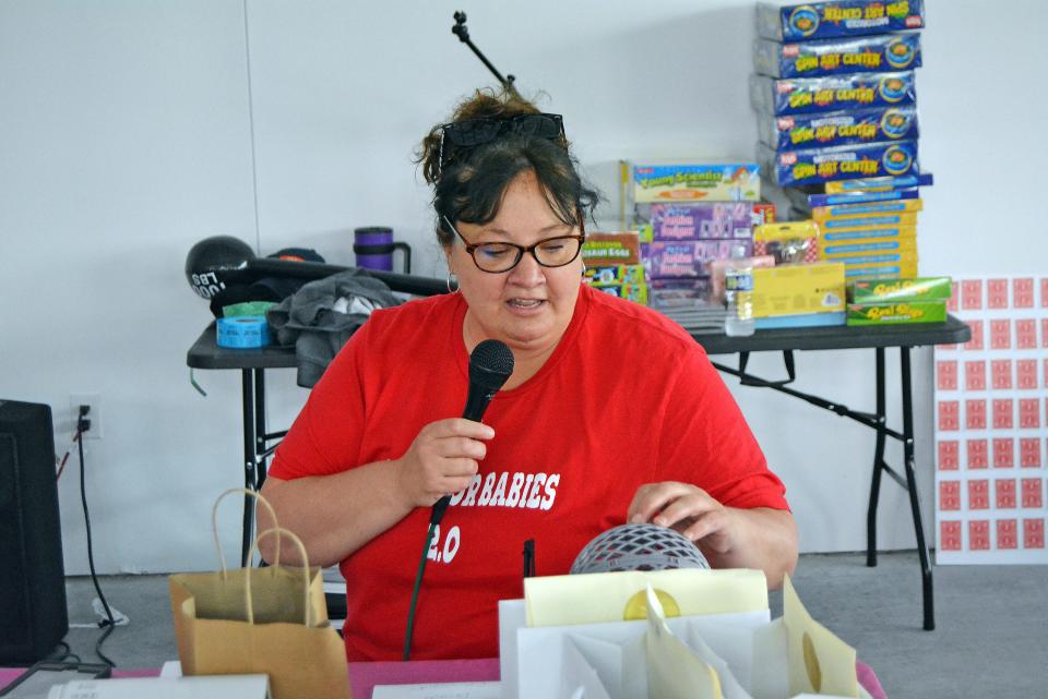 Central Missouri Community Action Headstart Health Administrator Jackie Rivera calls bingo May 11, 2023, at the Bingo for Babies fundraiser at a space in the Arcade District of Columbia.