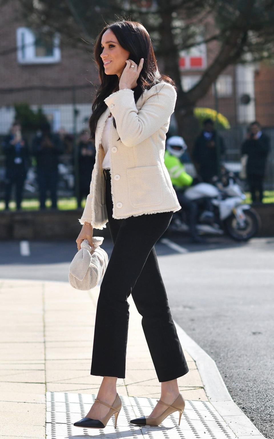 Meghan wearing one of her signature pared-back looks in March 2020 - Reuters