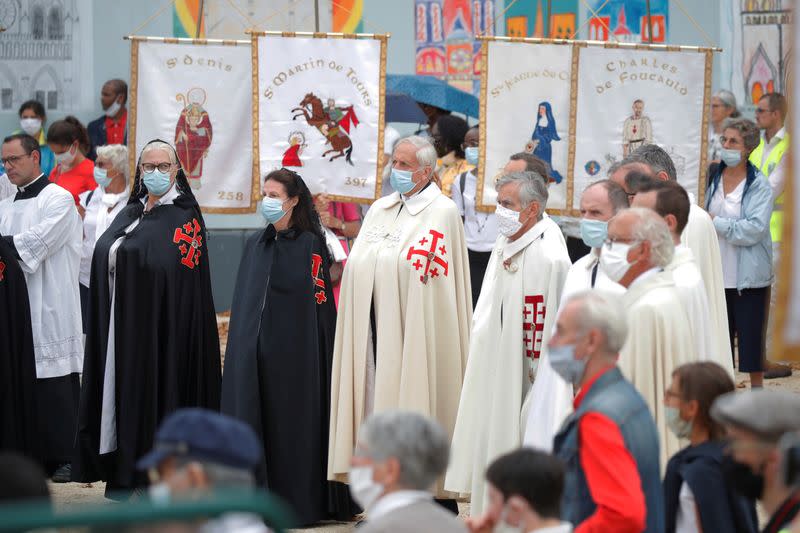 French Catholics gather at Notre Dame Cathedral square