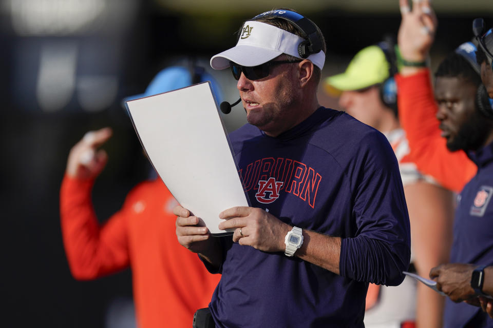 Auburn head coach Hugh Freeze calls a play from the sideline in the first half of an NCAA college football game against Vanderbilt, Saturday, Nov. 4, 2023, in Nashville, Tenn. (AP Photo/George Walker IV)