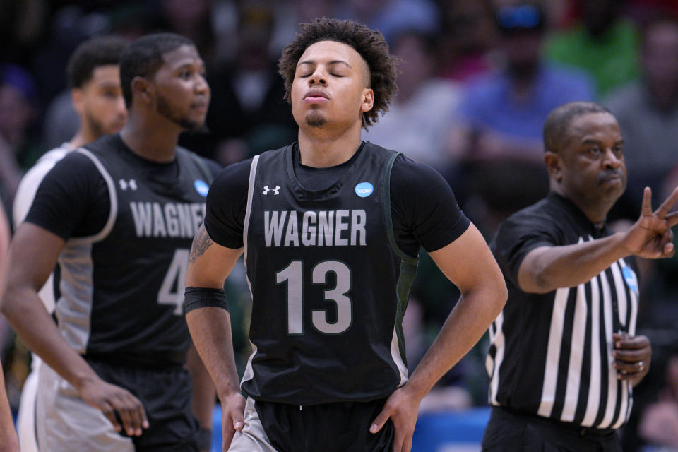 Wagner's Julian Brown (13) reacts prior to taking a free throw against Howard during the second half of a First Four college basketball game in the men's NCAA Tournament on Tuesday, March 19, 2024, in Dayton, Ohio. (AP Photo/Jeff Dean)