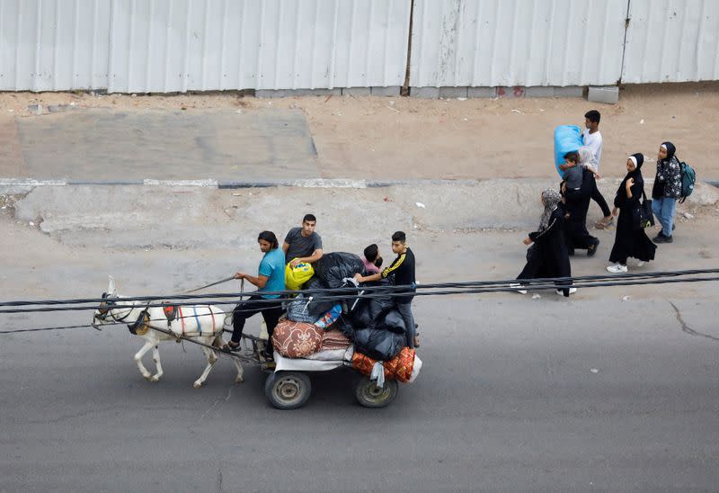 FILE PHOTO: Palestinians flee their homes amid Israeli strikes, in Gaza