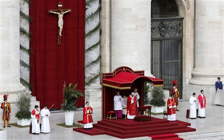 Pope Francis leads the Palm Sunday mass at Saint Peter's Square in the Vatican April 13, 2014. REUTERS/Giampiero Sposito