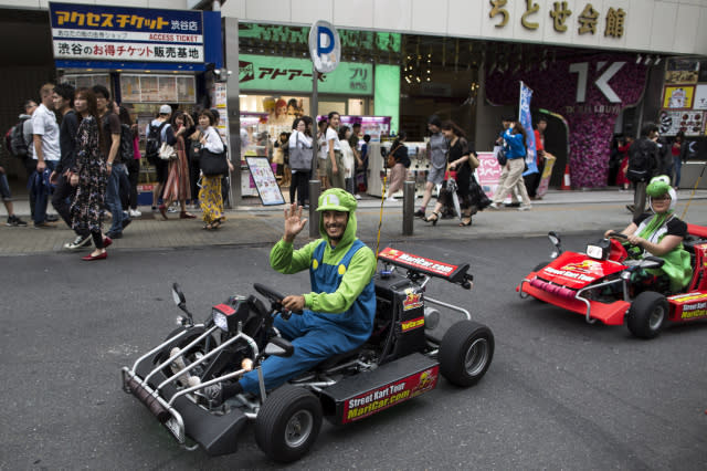 TOKYO, JAPAN - MAY 03:  Tourists wearing costumes of Nintendo game characters drive MariCar go-carts on a street in the Shibuya area on May 3, 2018 in Tokyo, Japan. Japan has kicked off Golden Week holiday, a series of national holidays starting in the last week of April.  (Photo by Tomohiro Ohsumi/Getty Images)